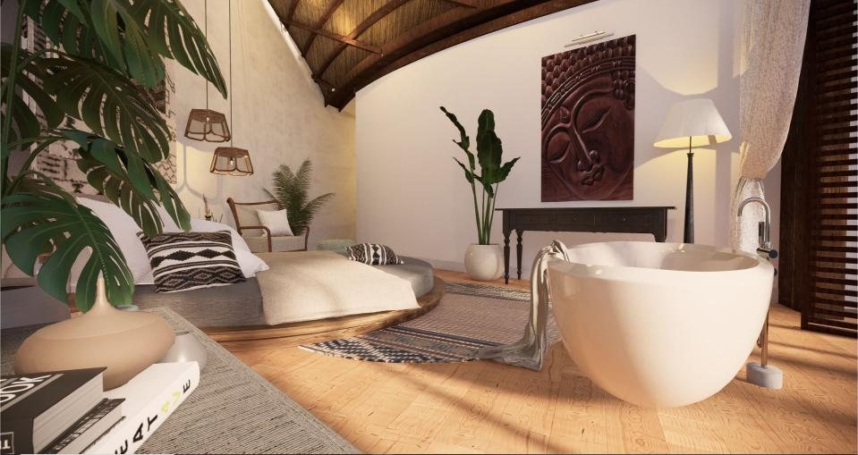 Naturally lit villa bedroom with freestanding tub and vaulted timber ceiling